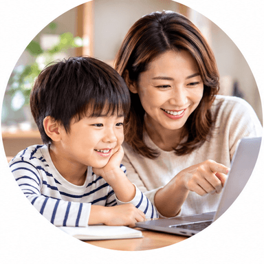 Parent and child reading an explanation together on a laptop